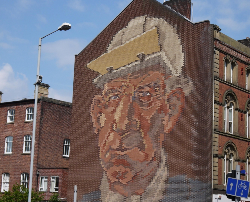 Brick mural of steelworker in sheffield