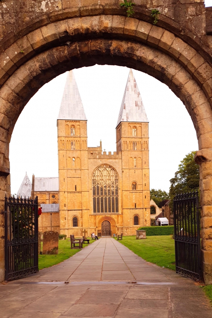 A photo of Southwell Minster through the entrance arch